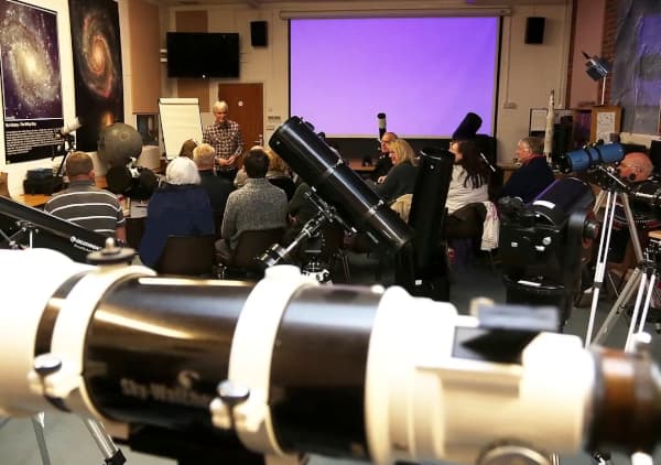 A photograph of members of the public at a telescope course in the  lecture theatre
