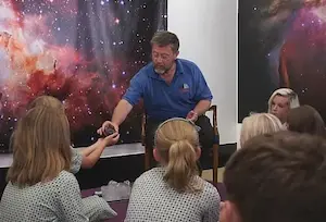  Children Handling meteorites.